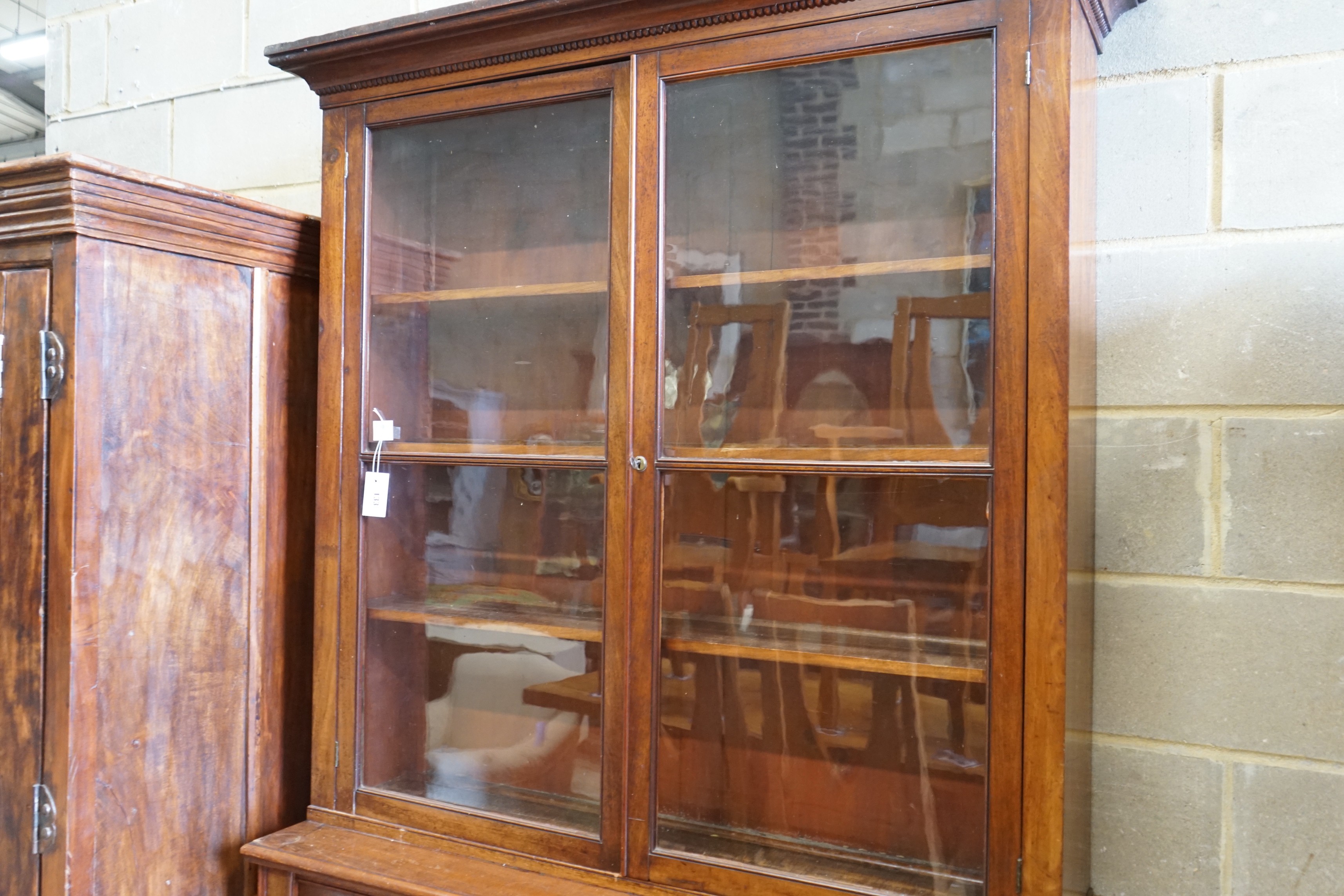 A late Victorian mahogany bookcase, length 122cm, depth 41cm, height 218cm